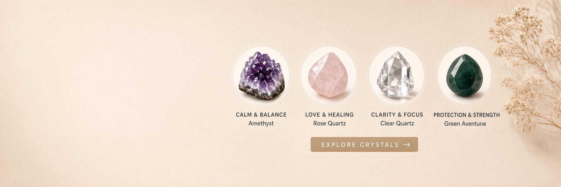 Curated gemstone collection — rose quartz heart, amethyst cluster and citrine point arranged on linen with gold rings
